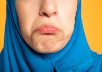 Image showing Portrait of young muslim woman isolated on yellow studio background