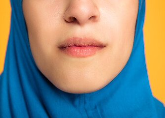 Image showing Portrait of young muslim woman isolated on yellow studio background