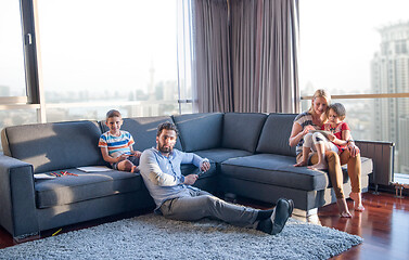 Image showing Happy Young Family Playing Together on sofa