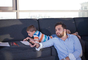 Image showing Happy Young Family Playing Together on sofa