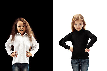 Image showing portrait of two emotional girls on a white and black background