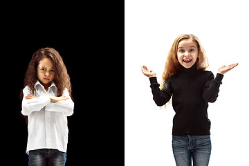 Image showing portrait of two emotional girls on a white and black background