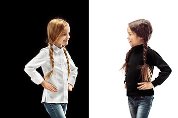 Image showing portrait of two happy girls on a white and black background