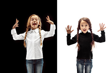 Image showing portrait of two happy girls on a white and black background