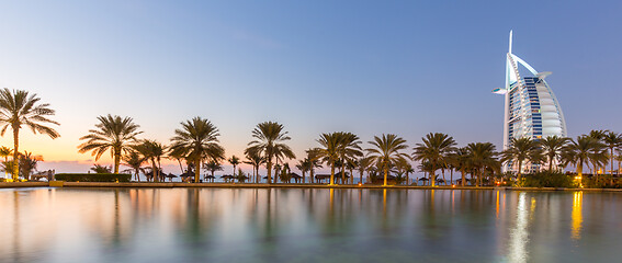 Image showing Dubai landmark, seven star luxury hotel Burj Al Arab at dusk, UAE