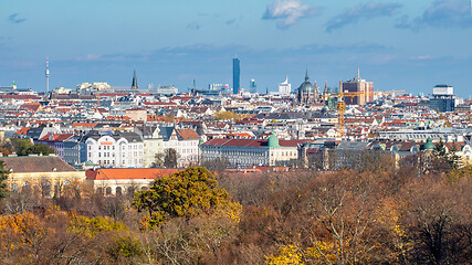 Image showing Urban landscape with roofs of historic and modern buildings in Vienna.