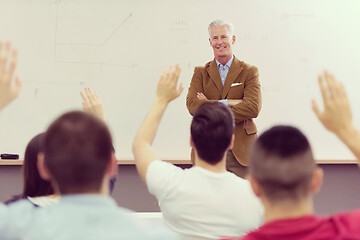 Image showing teacher with a group of students in classroom