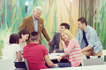 Image showing teacher with a group of students in classroom