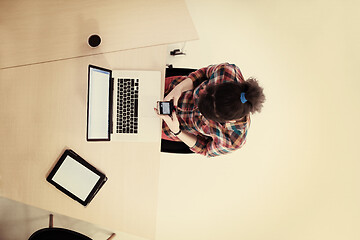 Image showing top view of young business woman working on laptop