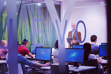 Image showing teacher and students in computer lab classroom