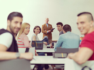 Image showing teacher with a group of students in classroom