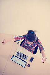 Image showing top view of young business woman working on laptop