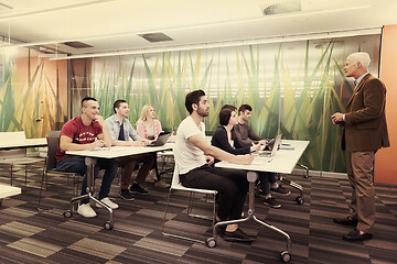 Image showing teacher with a group of students in classroom