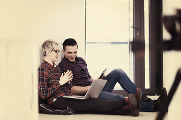 Image showing startup business, couple working on laptop computer at office