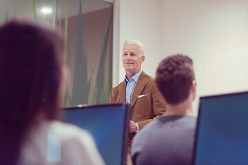 Image showing teacher and students in computer lab classroom