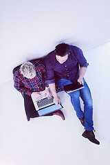 Image showing top view of  couple working on laptop computer at startup office