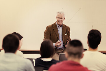 Image showing teacher with a group of students in classroom