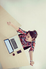 Image showing top view of young business woman working on laptop