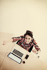 Image showing top view of young business woman working on laptop