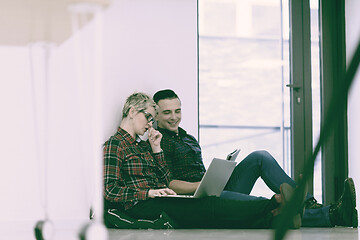 Image showing startup business, couple working on laptop computer at office