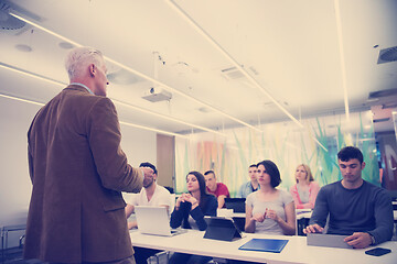 Image showing teacher with a group of students in classroom