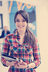 Image showing portrait of young business woman at office with team in backgrou