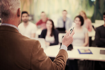 Image showing teacher with a group of students in classroom