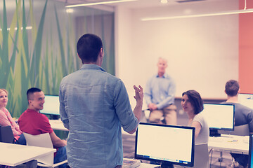 Image showing student answering a question in classroom