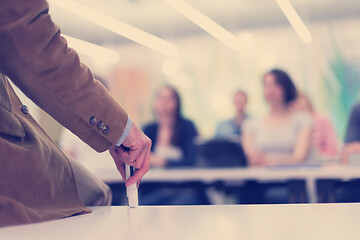 Image showing close up of teacher hand while teaching in classroom