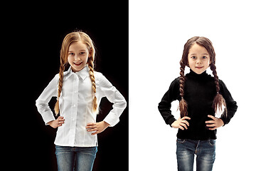 Image showing portrait of two happy girls on a white and black background