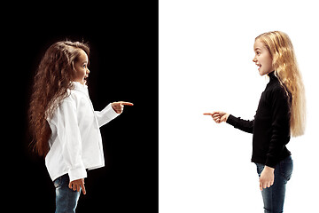 Image showing portrait of two happy girls on a white and black background