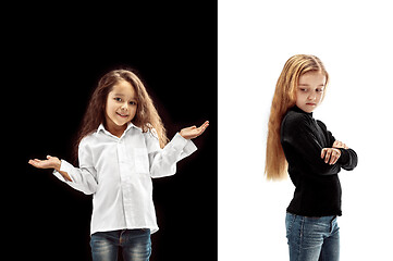 Image showing portrait of two emotional girls on a white and black background