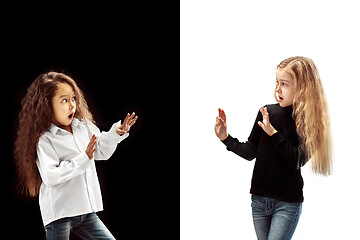 Image showing portrait of two happy girls on a white and black background