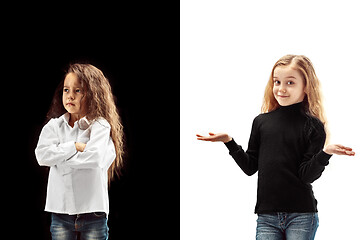 Image showing portrait of two emotional girls on a white and black background