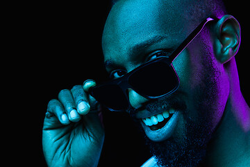 Image showing Close up portrait of a young african man indoors