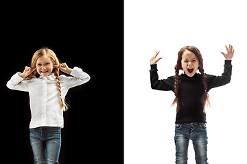 Image showing portrait of two happy girls on a white and black background