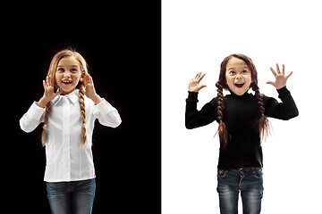 Image showing portrait of two happy girls on a white and black background