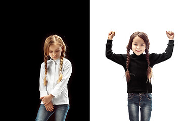 Image showing portrait of two emotional girls on a white and black background