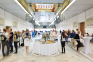 Image showing Abstract blurred people socializing during lunch break at business conference.