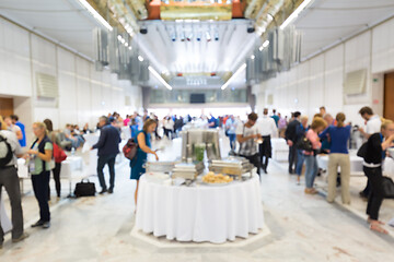 Image showing Abstract blurred people socializing during lunch break at business conference.