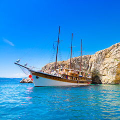 Image showing Vintage sailing boat in bay.