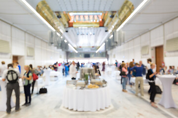 Image showing Abstract blurred people socializing during lunch break at business conference.