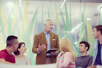 Image showing teacher with a group of students in classroom