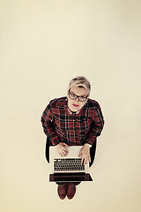 Image showing top view of young business woman working on laptop computer