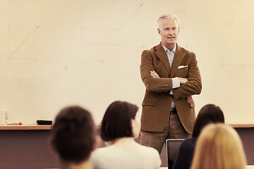 Image showing teacher with a group of hi school students in classroom