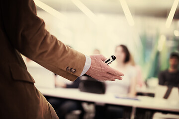 Image showing close up of teacher hand while teaching in classroom