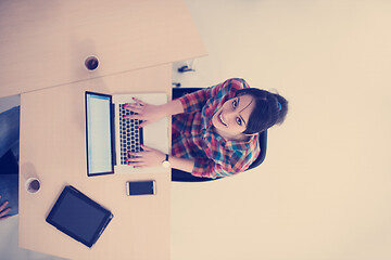 Image showing top view of young business woman working on laptop