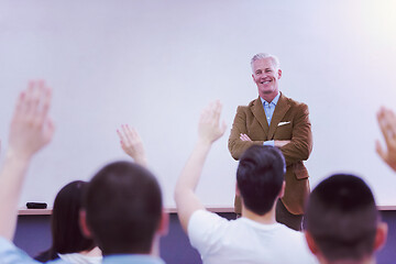 Image showing teacher with a group of students in classroom