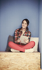 Image showing woman in crative box working on tablet