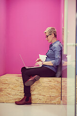 Image showing woman in crative box working on laptop